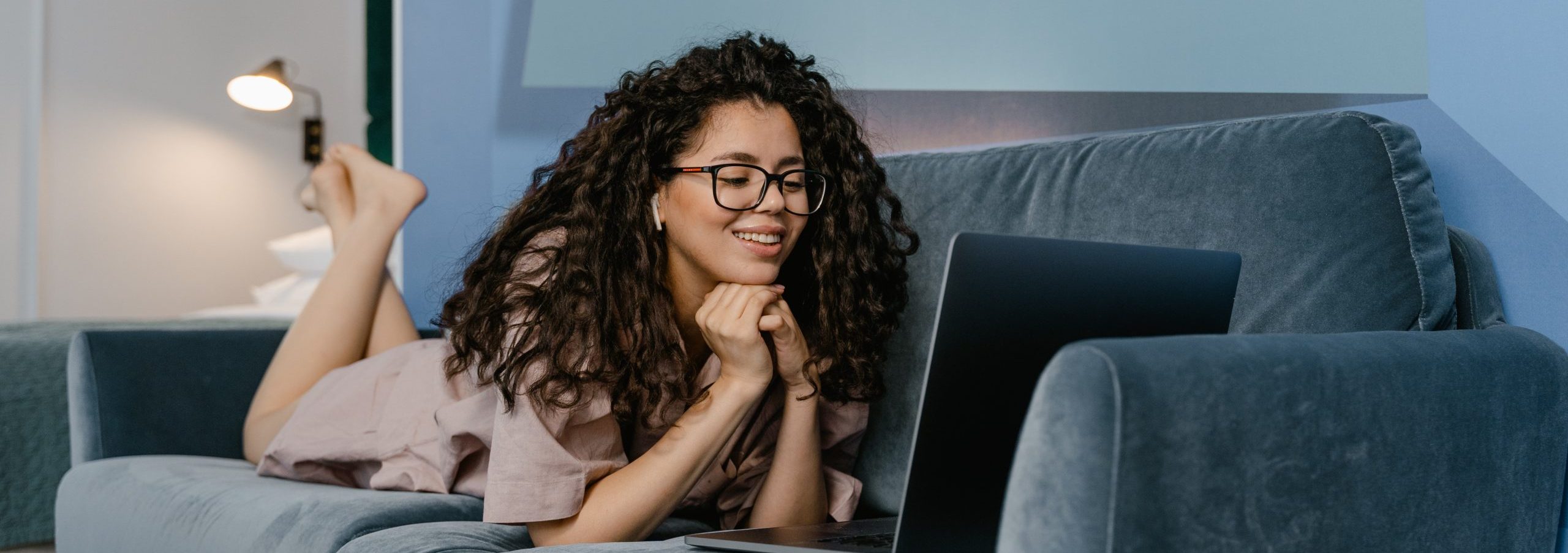 Woman on the sofa thinking about payday loan advantages