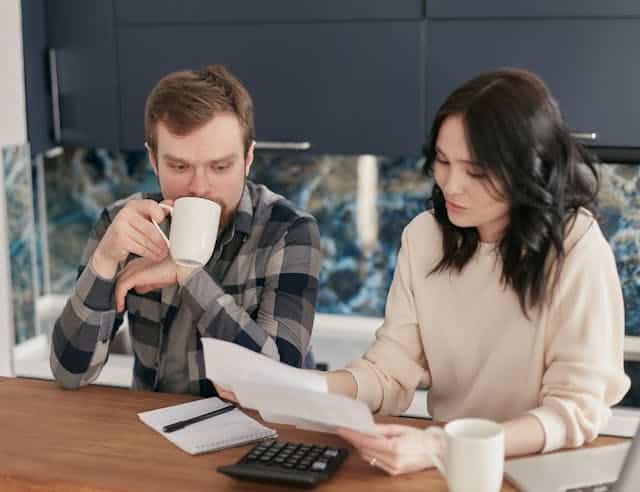 A couple applying for a holiday payday loan. 